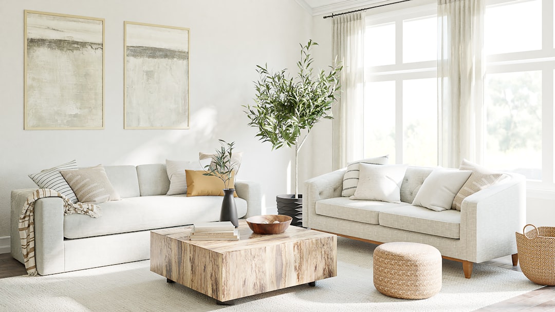 A cozy living room with fresh decor elements, including cushions, plants, and artwork, showcasing a vibrant and inviting atmosphere.