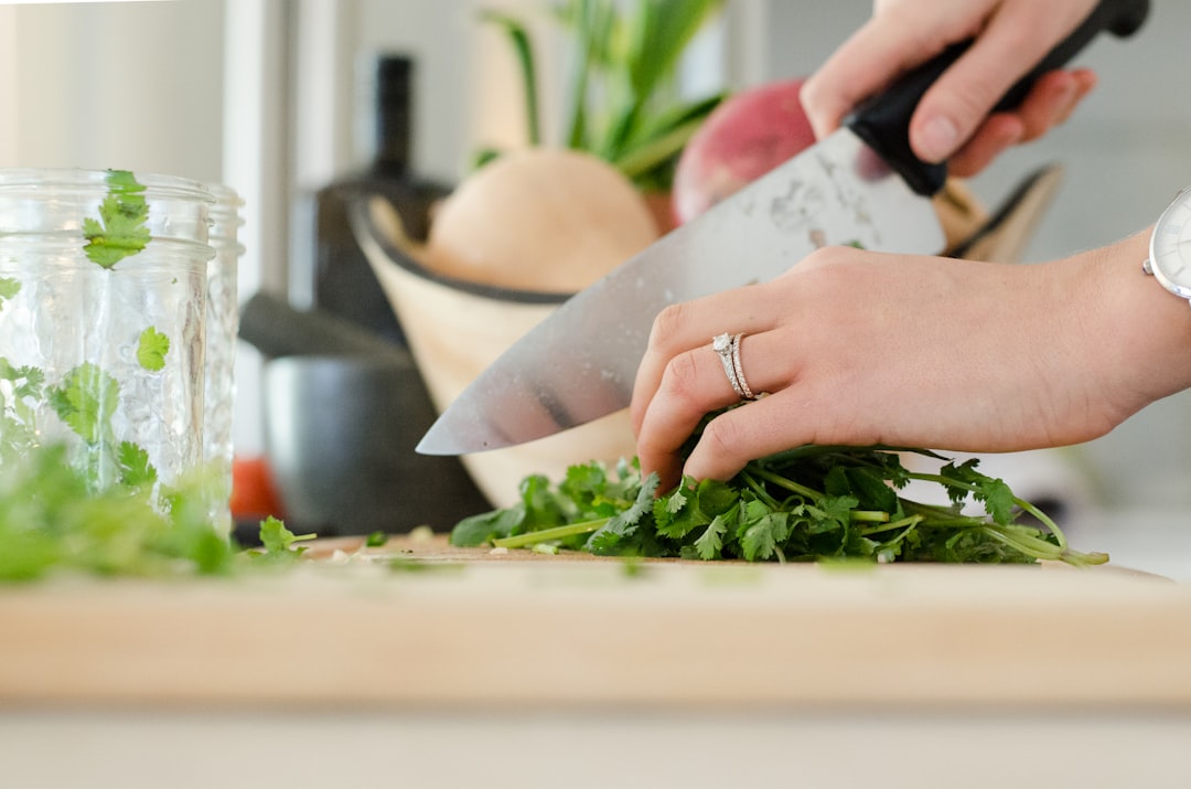 A well-organized kitchen countertop with essential cooking tools, cookware, and appliances neatly arranged.